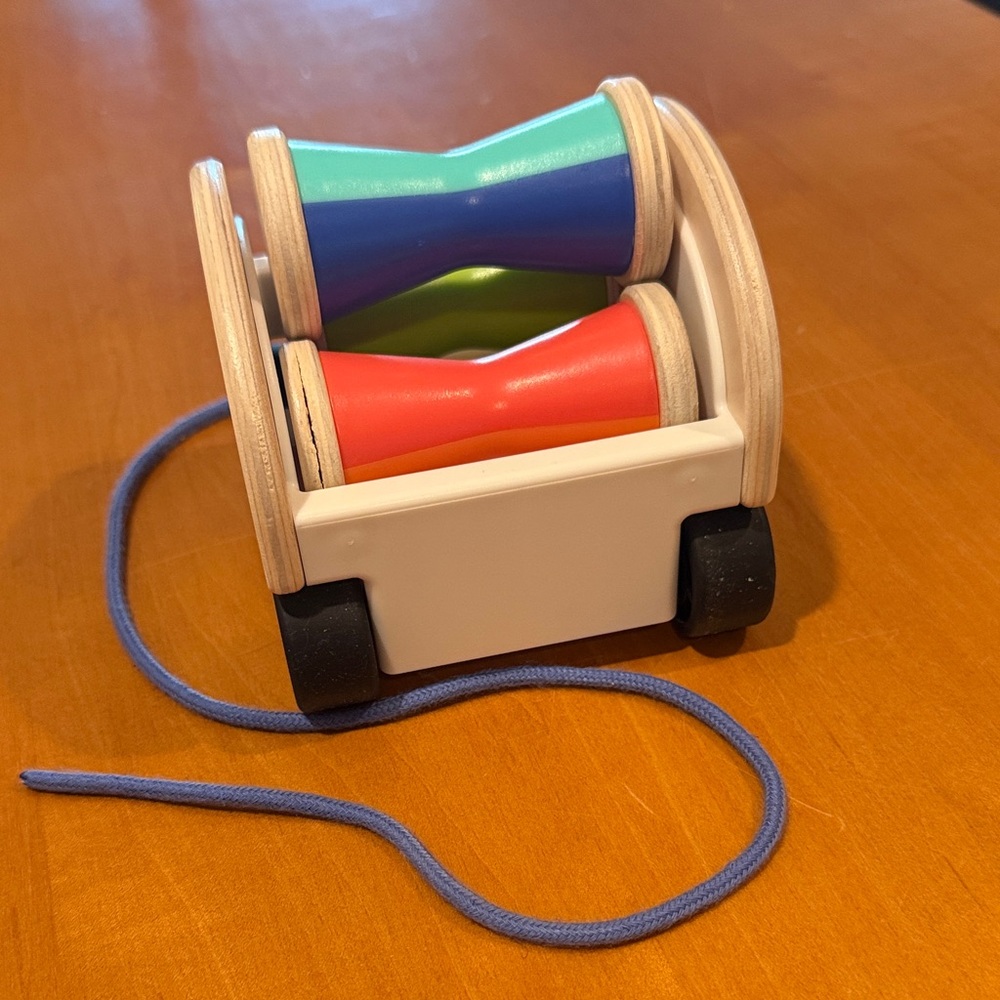 Vibrant Wooden Pull Toy with Red and Blue Accents